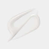 A creamy, off-white swatch of Sulwhasoo's Concentrated Ginseng Brightening Serum demonstrates its luxurious texture, promising radiance and improved skin elasticity.